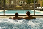 alt="Couple enjoying Garden View from Indoor Pool"